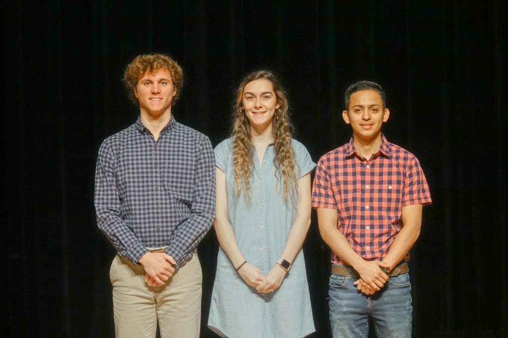 A group of people posing for a photo
Description automatically generated